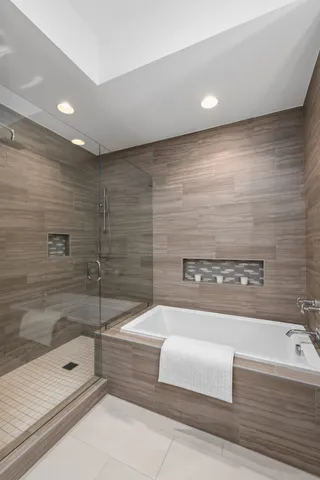 a bathroom with a bathtub and shower