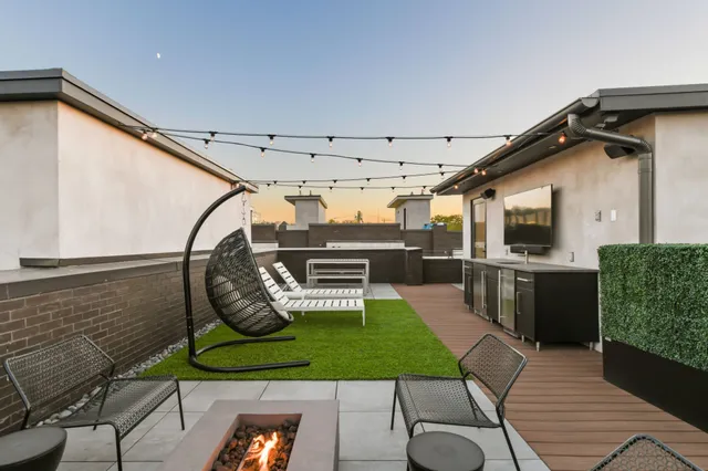 a view of a chairs and table in a patio