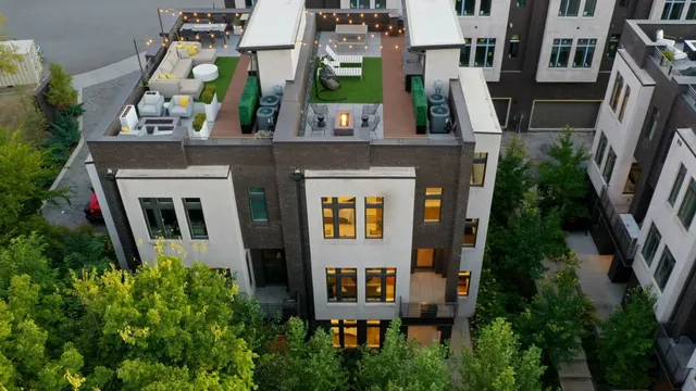 an aerial view of a residential apartment building with a yard