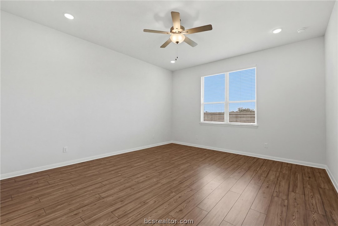 1922 Viva Road Bryan, TX 77807 - Photo 45 of 45 Spacious downstairs primary suite tucked away off the living room in a desirable split floor plan.
