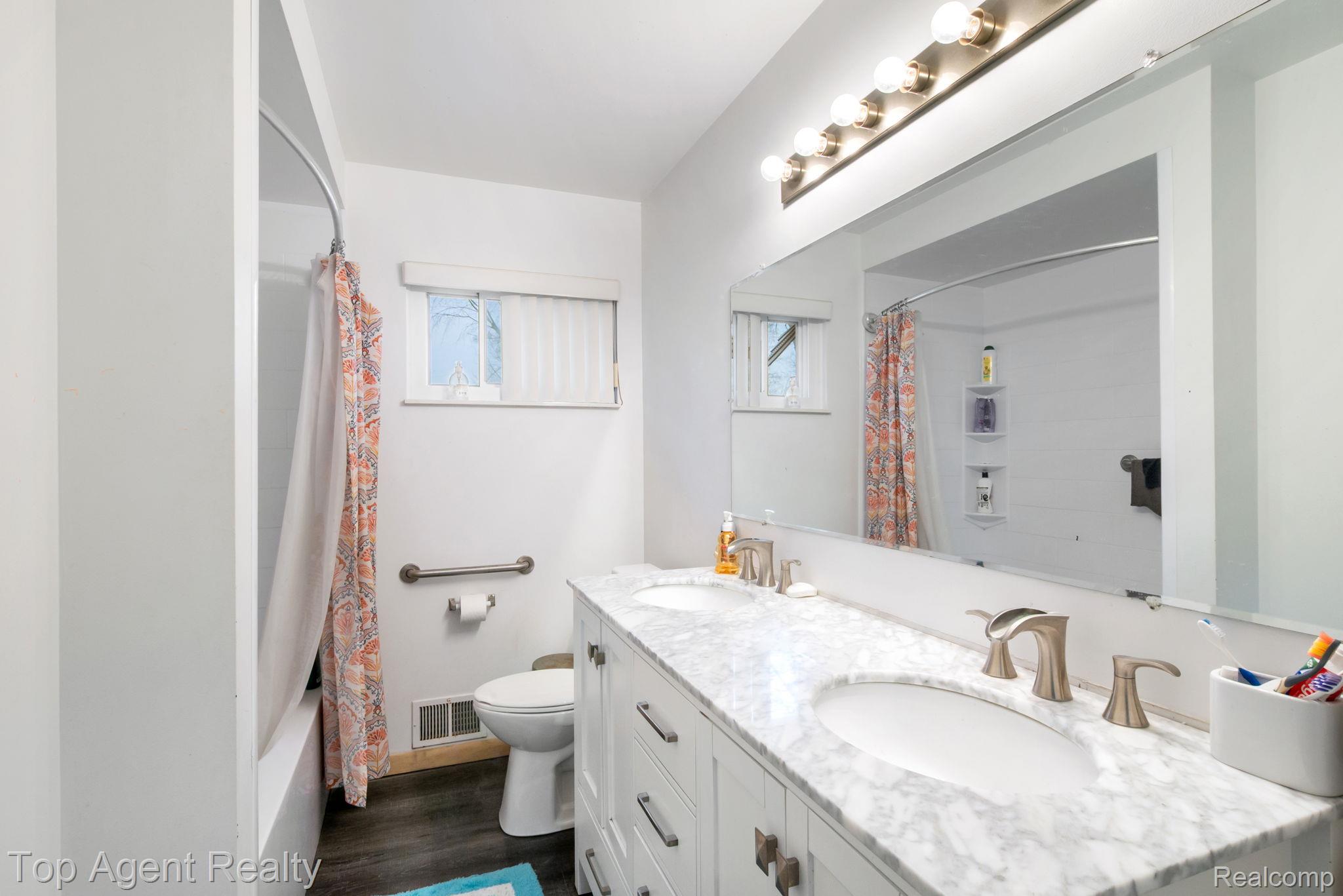 2065 Ridgemont Street Commerce Township, MI 48382 - Photo 18 of 35 Full bathroom featuring double vanity, shower / tub combo with curtain, and dark wood-style flooring