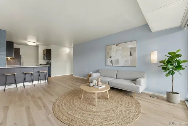 a living room with furniture and a table