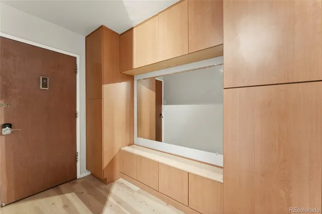 a bedroom with a bed and a cabinets