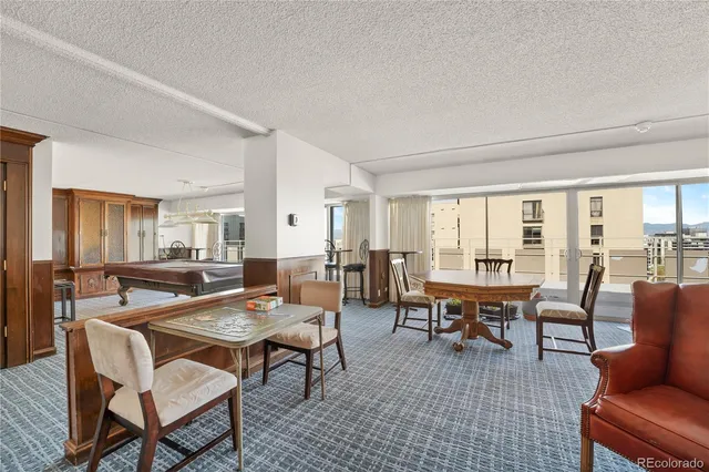 a view of a patio with a table and chairs