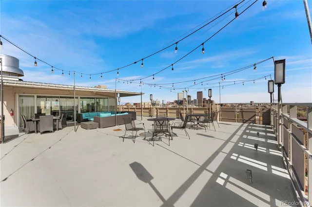 a view of a swimming pool with outdoor seating