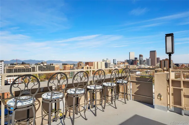 a view of steet with seating area