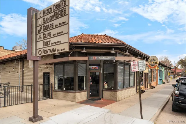 a view of a patio with dining table and chairs