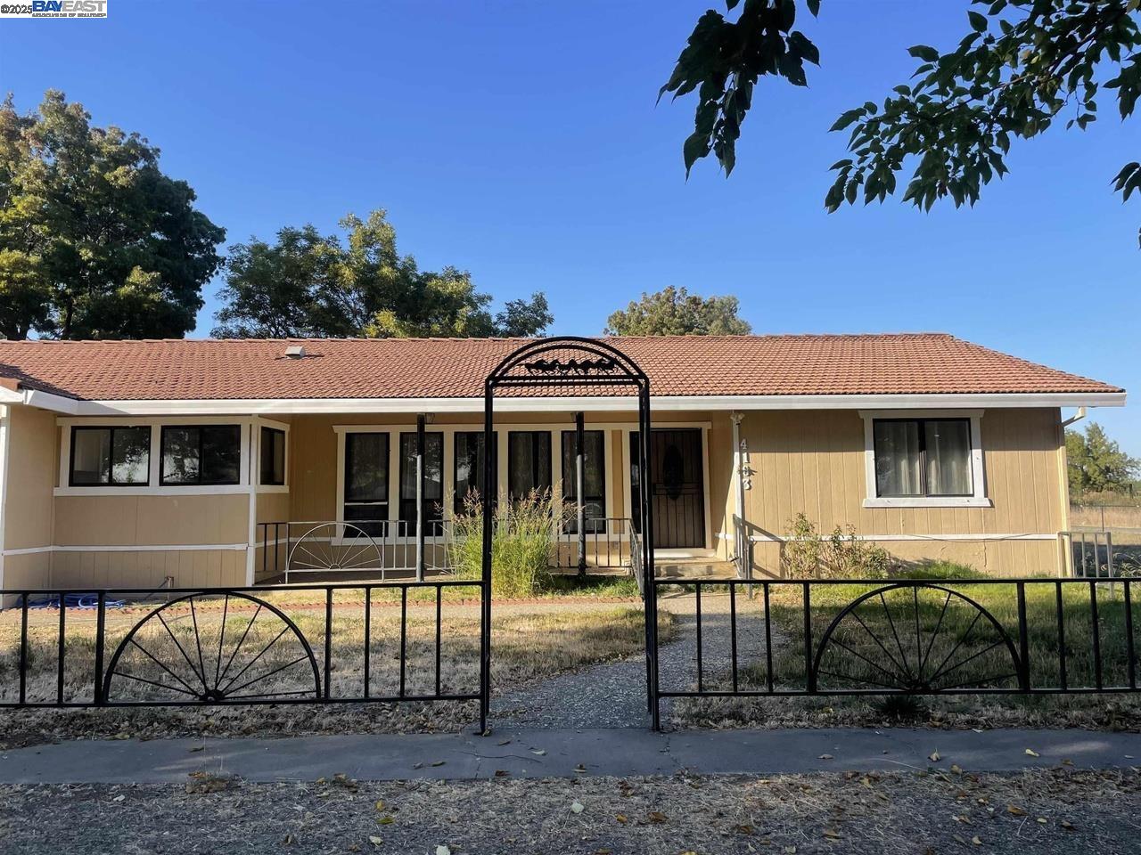 4163 Sutton Road Maxwell, CA 95955 - Photo 1 of 1 a front view of a house with garden