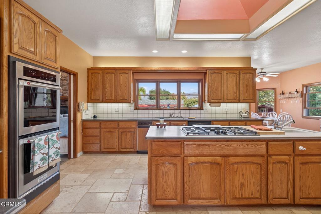 1125 Spring Street Oak View, CA 93022 - Photo 15 of 73 a kitchen with stainless steel appliances granite countertop a stove and a sink