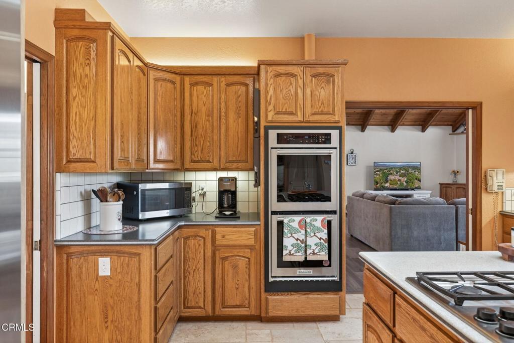 1125 Spring Street Oak View, CA 93022 - Photo 17 of 73 a kitchen with stainless steel appliances granite countertop a stove top oven