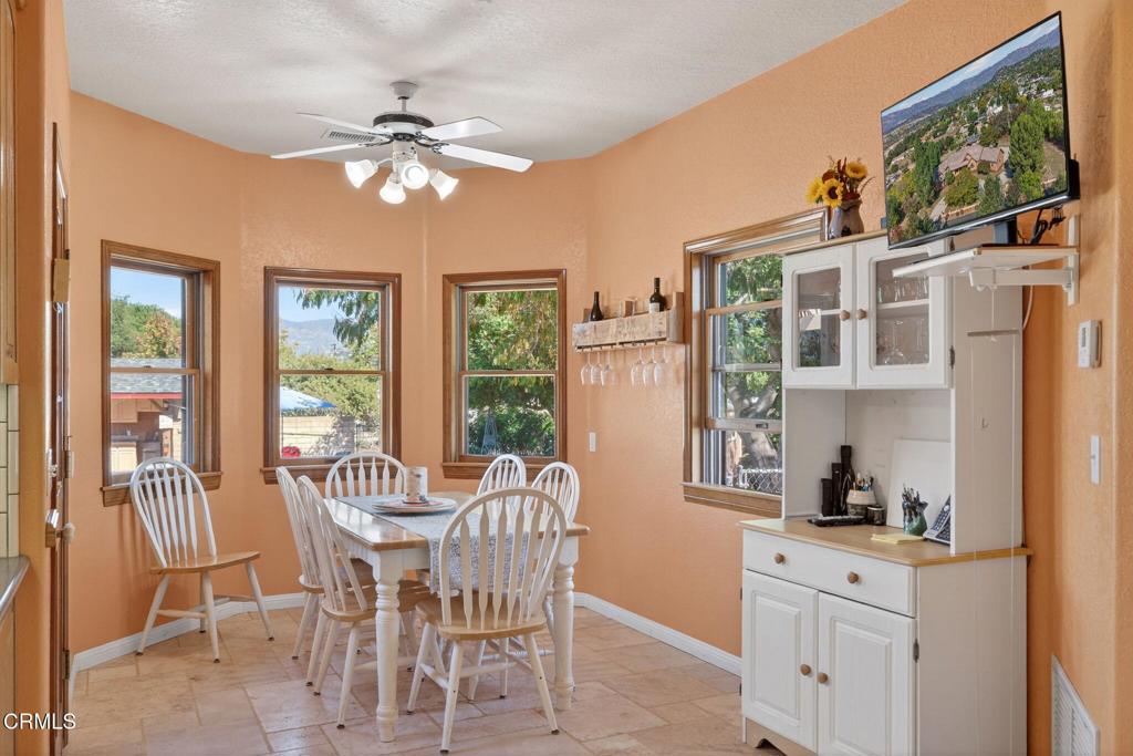 1125 Spring Street Oak View, CA 93022 - Photo 19 of 73 a view of a dining room with furniture a chandelier and window