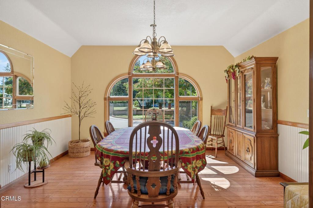 1125 Spring Street Oak View, CA 93022 - Photo 21 of 73 a view of a dining room with furniture window and wooden floor