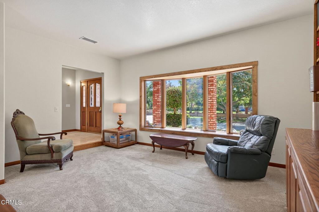 1125 Spring Street Oak View, CA 93022 - Photo 23 of 73 a living room with furniture and floor to ceiling window