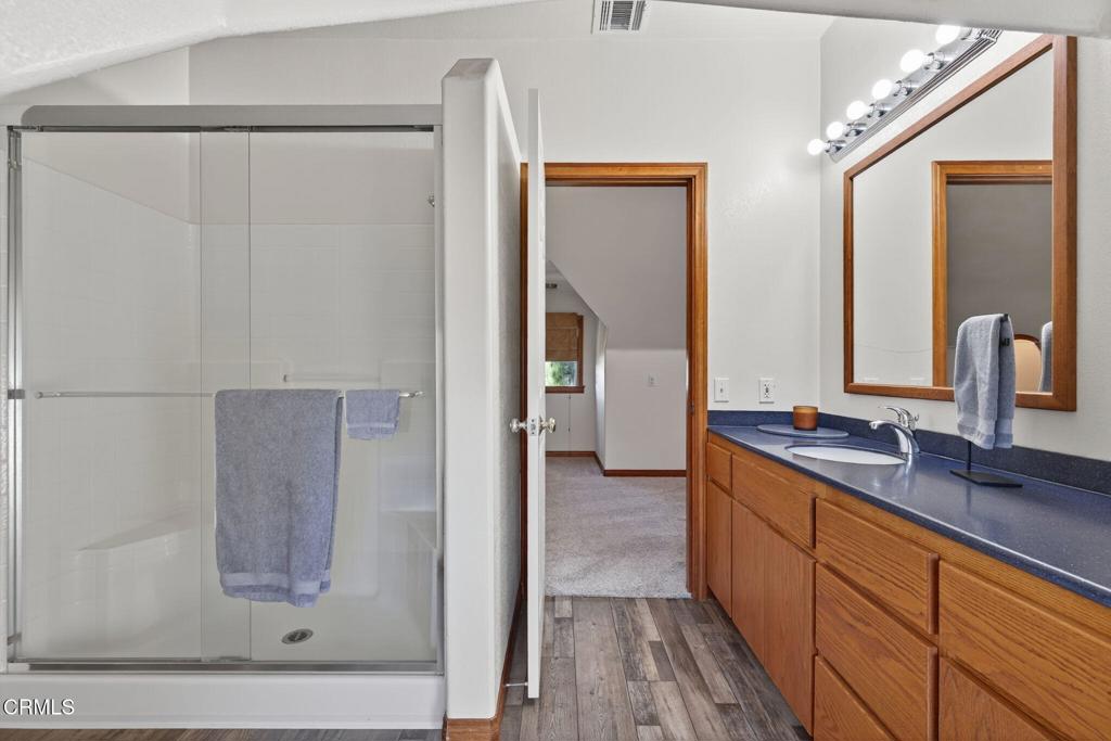 1125 Spring Street Oak View, CA 93022 - Photo 43 of 73 a bathroom with a double vanity sink and mirror