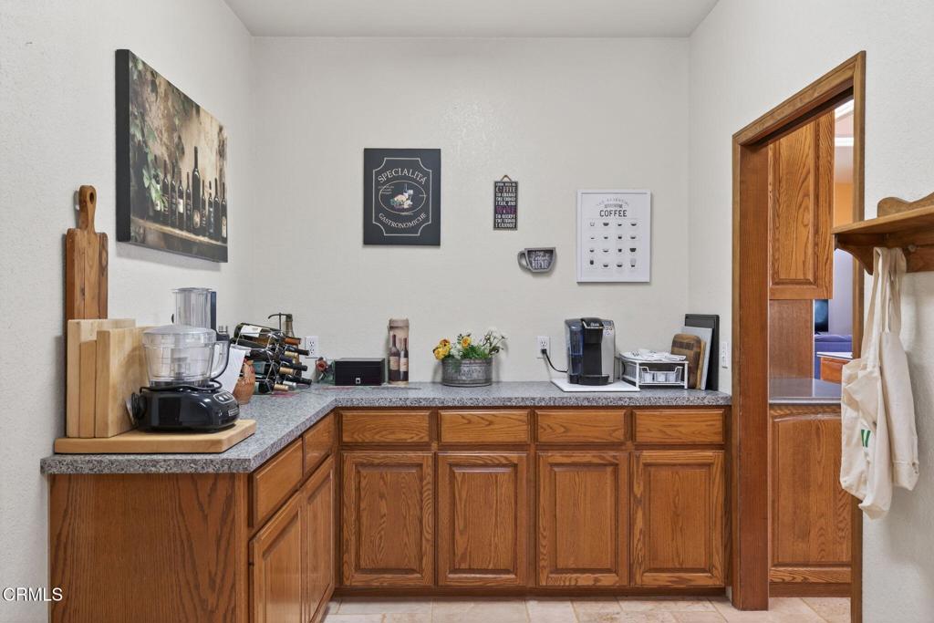 1125 Spring Street Oak View, CA 93022 - Photo 45 of 73 a kitchen with stainless steel appliances granite countertop a sink a stove and a refrigerator