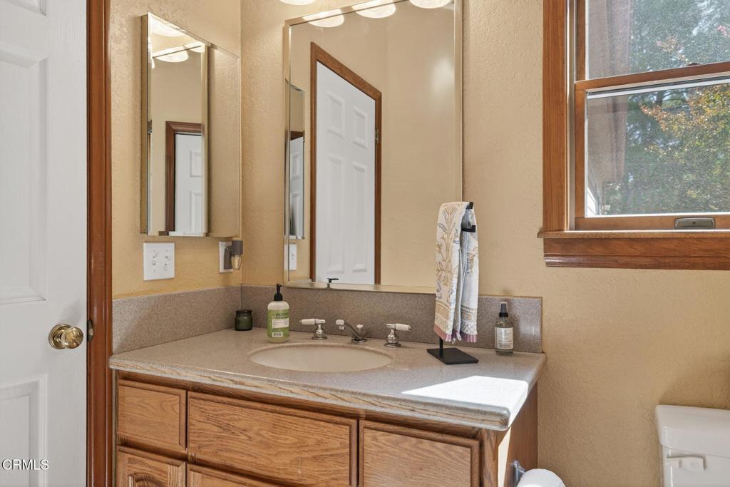 1125 Spring Street Oak View, CA 93022 - Photo 47 of 73 a bathroom with a sink and a mirror