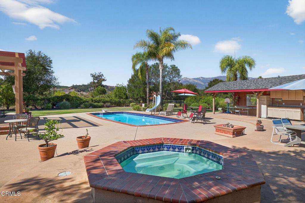 1125 Spring Street Oak View, CA 93022 - Photo 49 of 73 a swimming pool with outdoor seating and yard