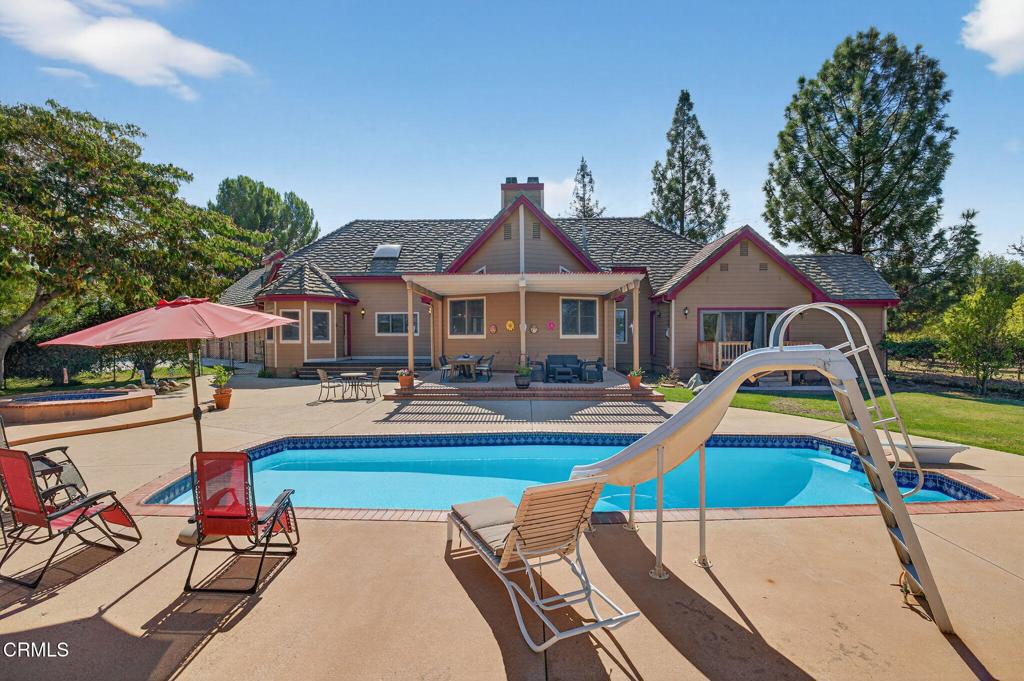 1125 Spring Street Oak View, CA 93022 - Photo 54 of 73 a view of swimming pool with lawn chairs under an umbrella