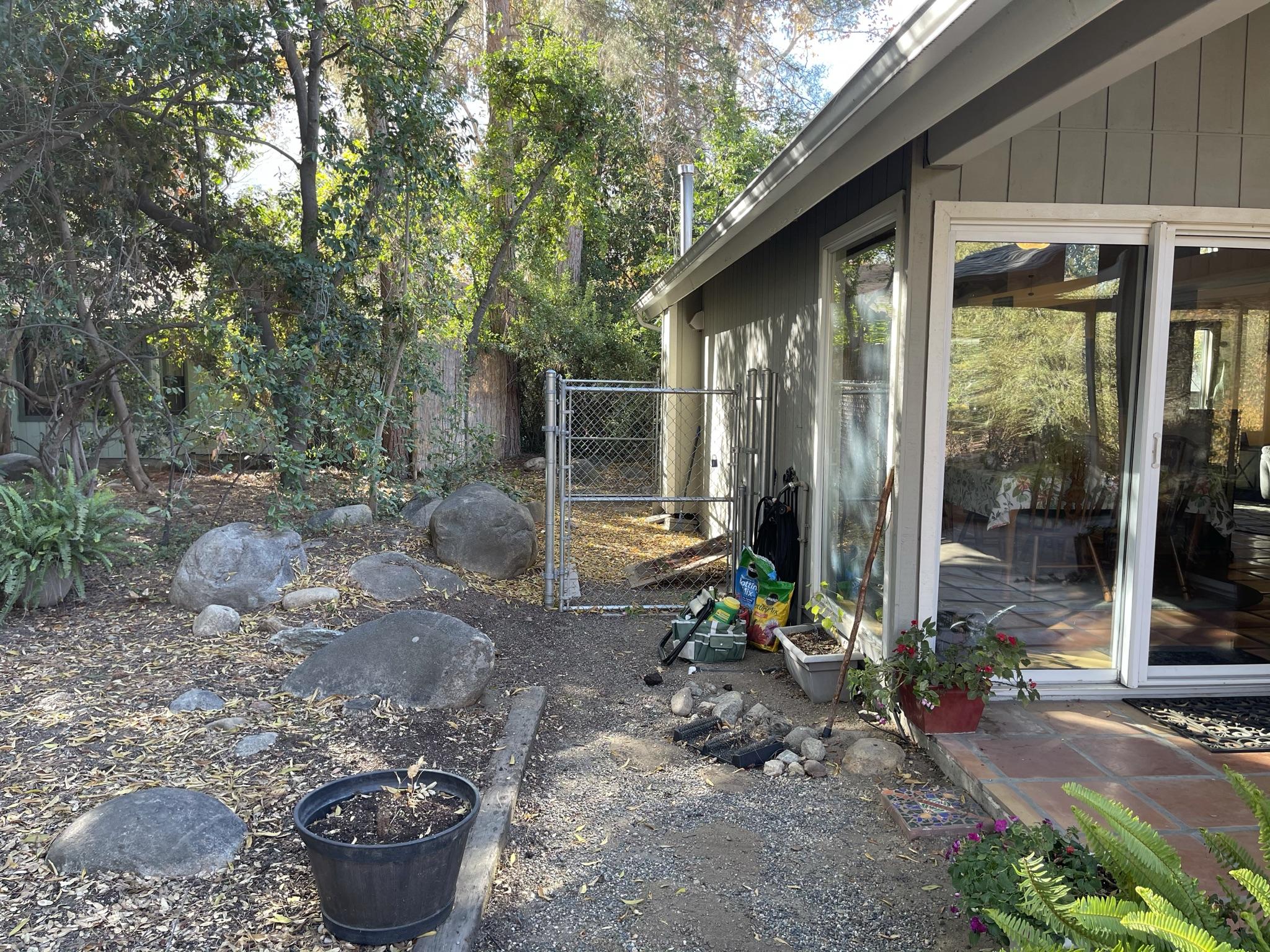 40964 Cherokee Oaks Drive Three Rivers, CA 93271 - Photo 34 of 41 a backyard of a house with fountain plants and outdoor seating