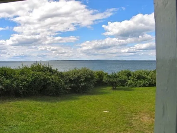 a view of a lake with a yard