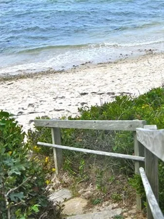 a view of a green field with sitting space