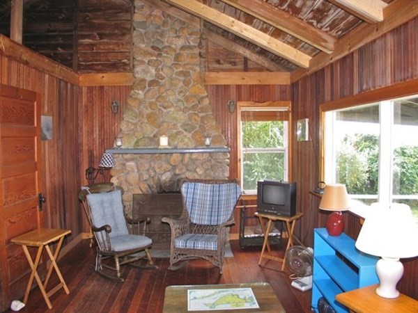 64 Bartimus Luce Road West Tisbury, MA 02568 - Photo 6 of 25 a living room with furniture and a window