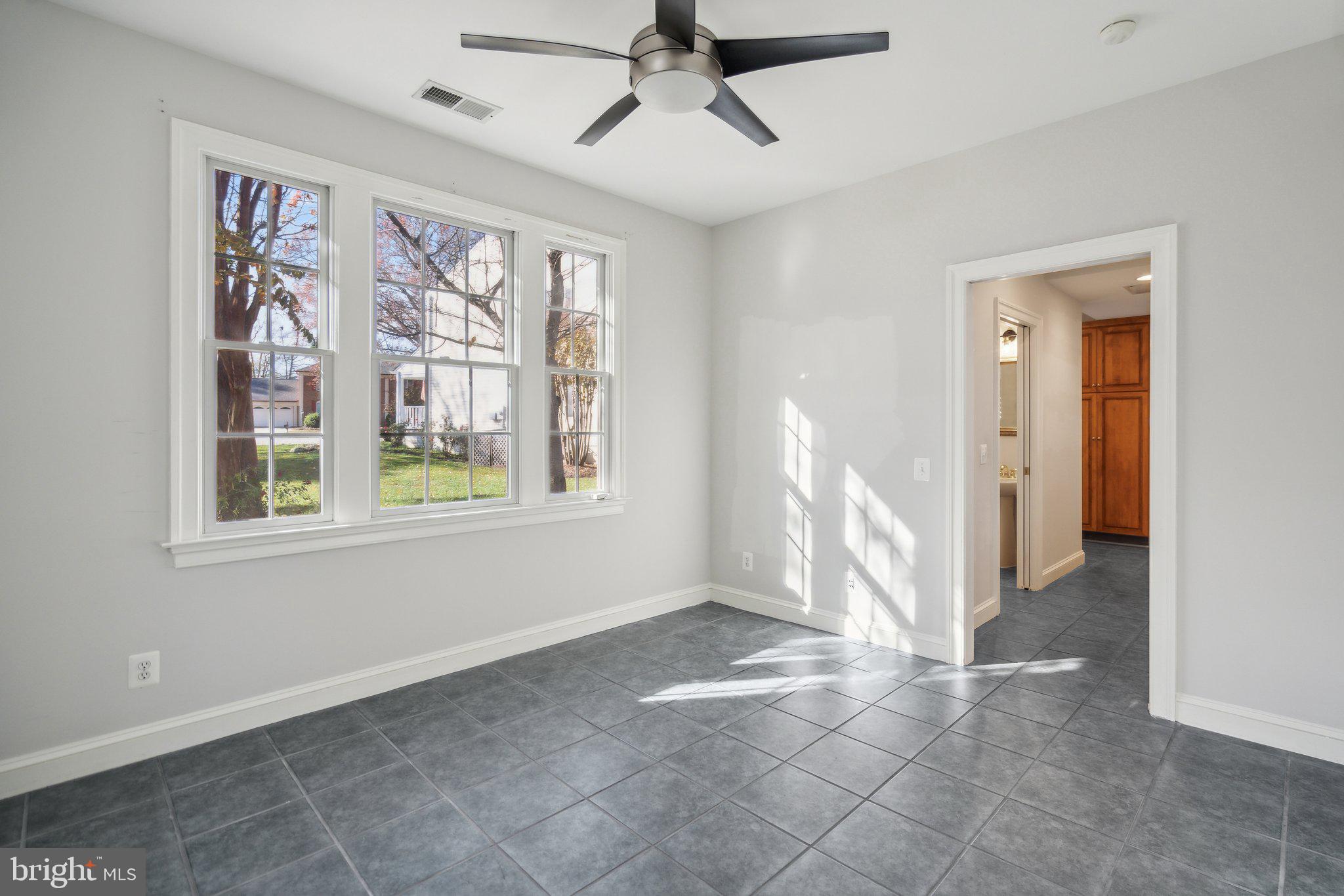 8802 Northern Spruce Lane Alexandria, VA 22309 - Photo 16 of 41 a view of empty room with windows and fan