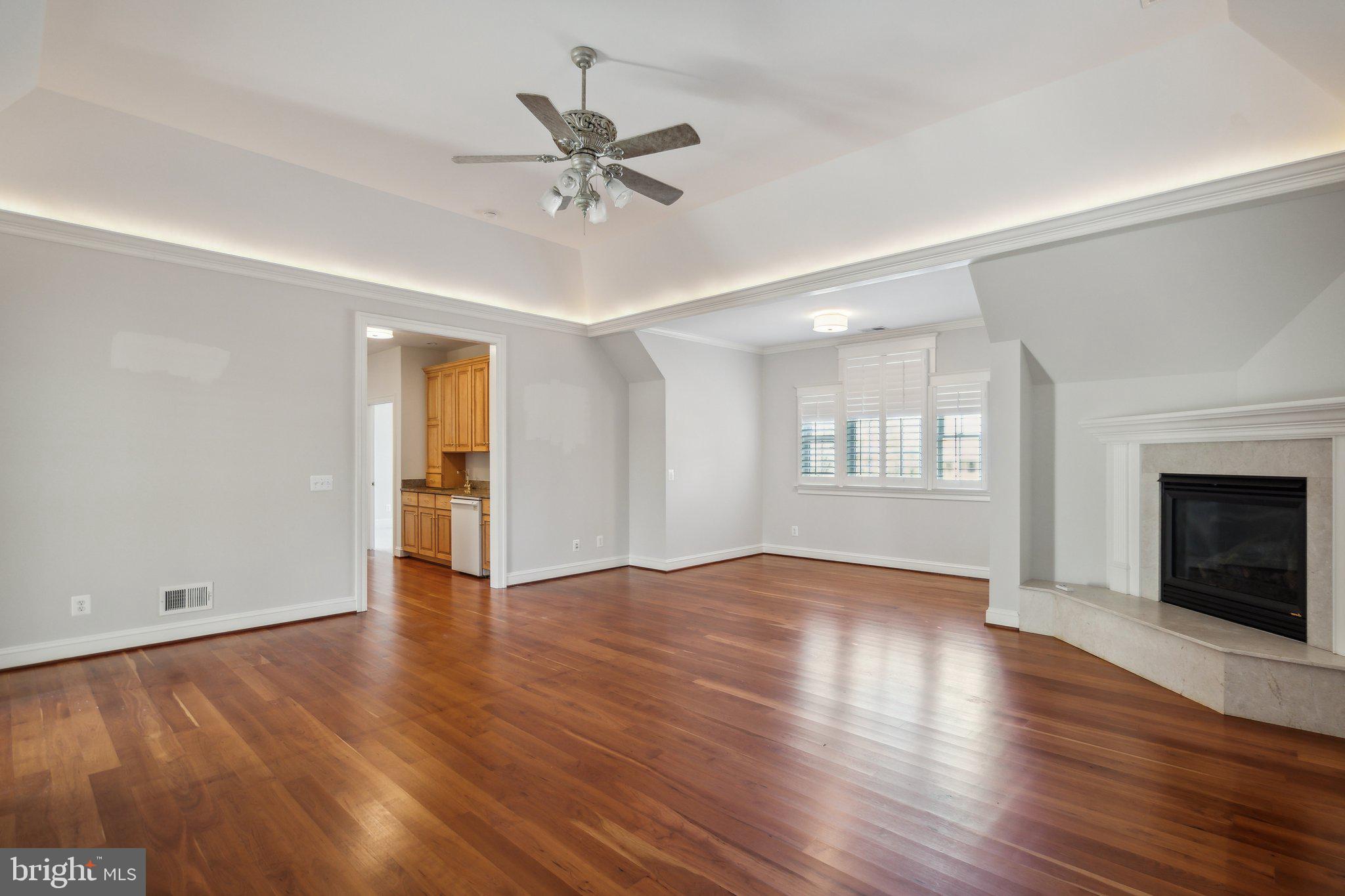 8802 Northern Spruce Lane Alexandria, VA 22309 - Photo 22 of 41 a view of an empty room with a window and fireplace