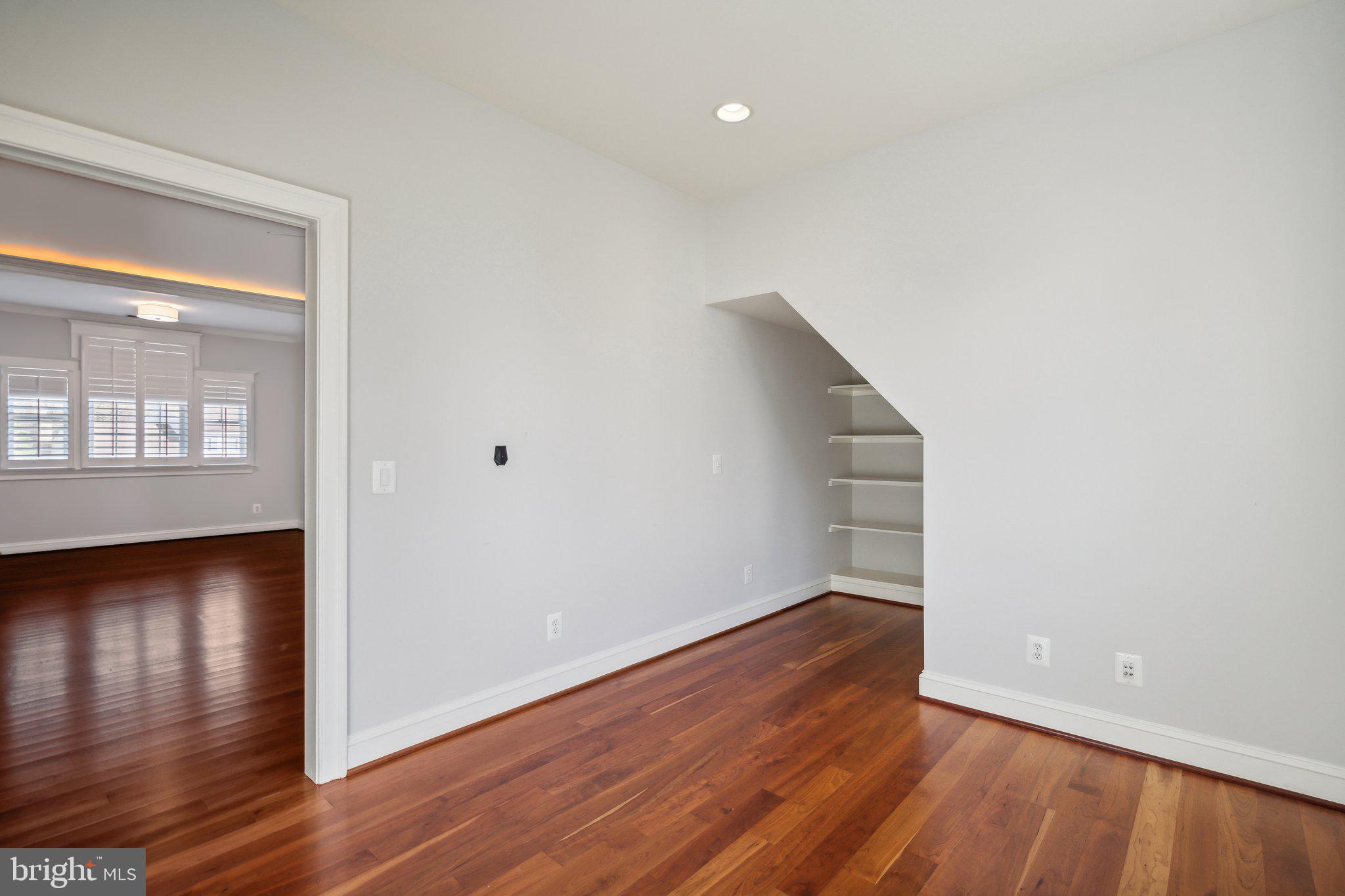 8802 Northern Spruce Lane Alexandria, VA 22309 - Photo 24 of 41 wooden floor in an empty room with a window