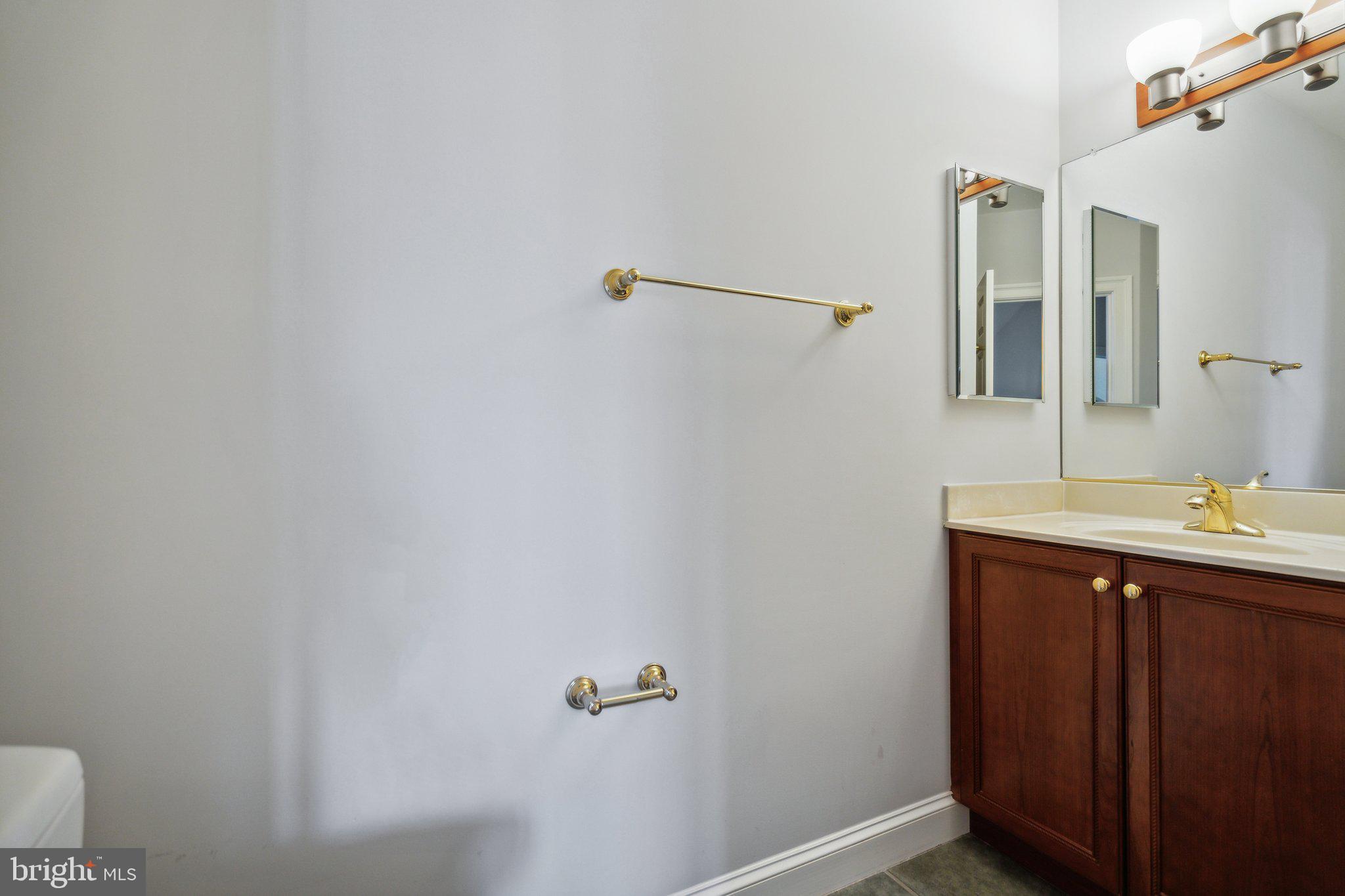 8802 Northern Spruce Lane Alexandria, VA 22309 - Photo 25 of 41 a bathroom with a sink and mirror