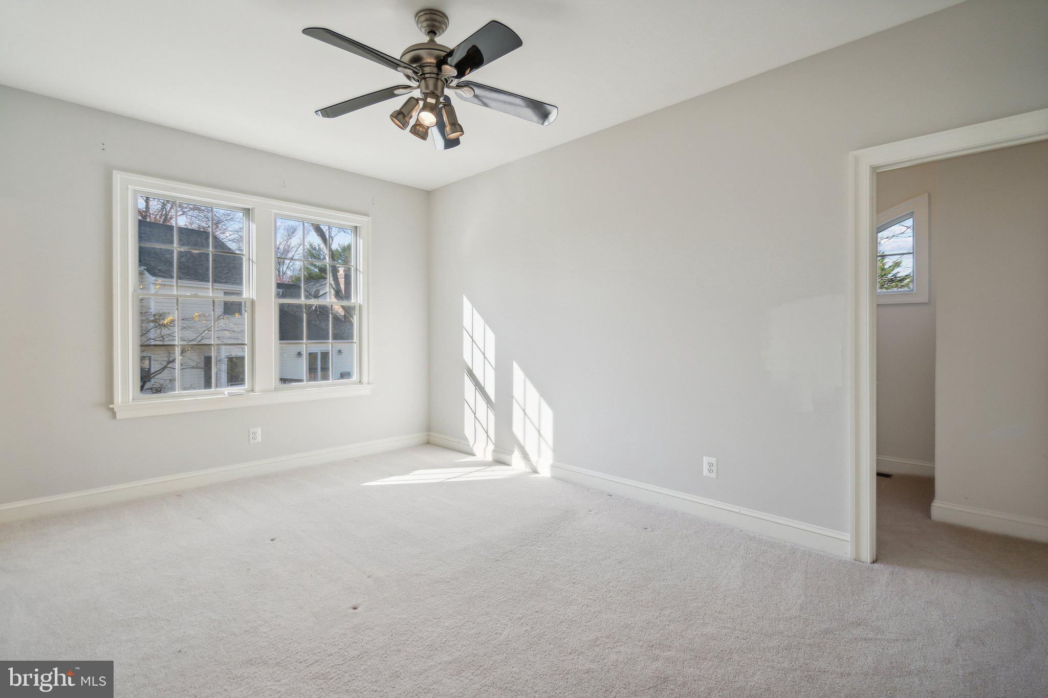 8802 Northern Spruce Lane Alexandria, VA 22309 - Photo 26 of 41 wooden floor in an empty room with a window