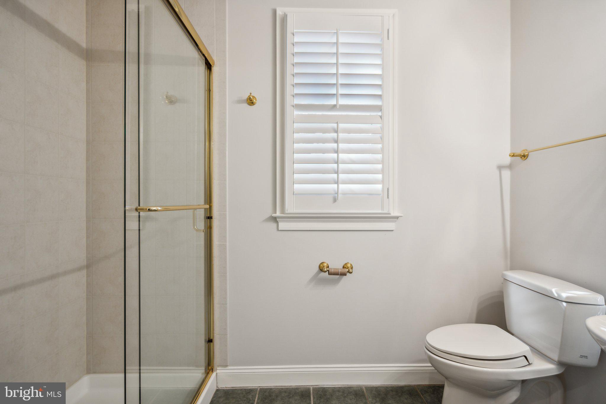 8802 Northern Spruce Lane Alexandria, VA 22309 - Photo 34 of 41 a bathroom with a toilet and a shower