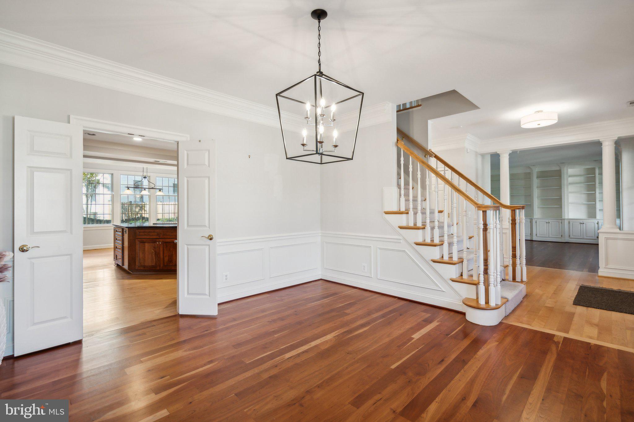 8802 Northern Spruce Lane Alexandria, VA 22309 - Photo 6 of 41 a view of a room with wooden floor and stairs