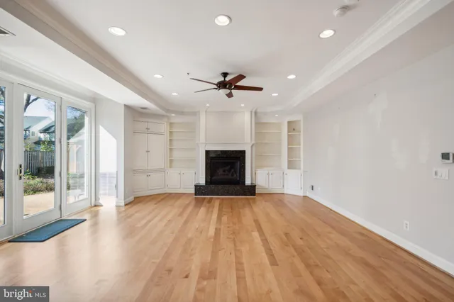 wooden floor in an empty room with a fireplace