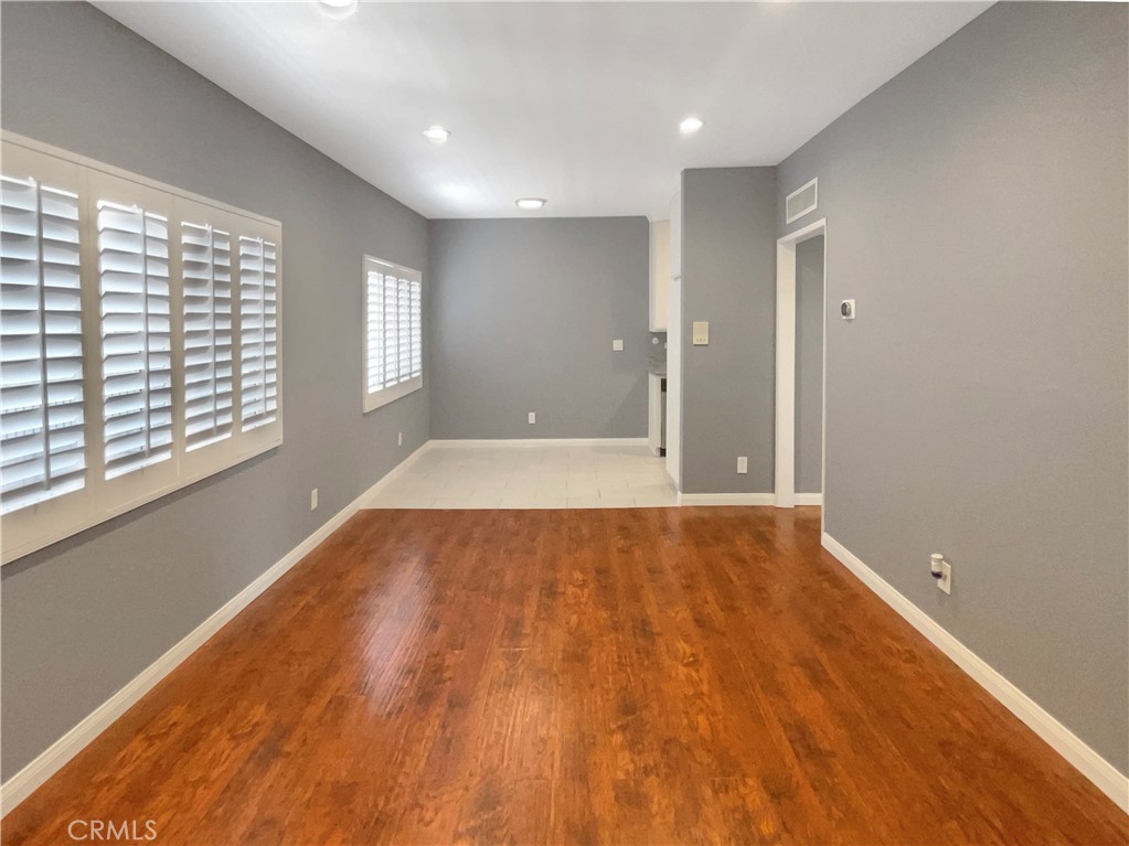 14560 Clark Street, Unit 202 Sherman Oaks, CA 91411 - Photo 2 of 18 wooden floor in an empty room with a window