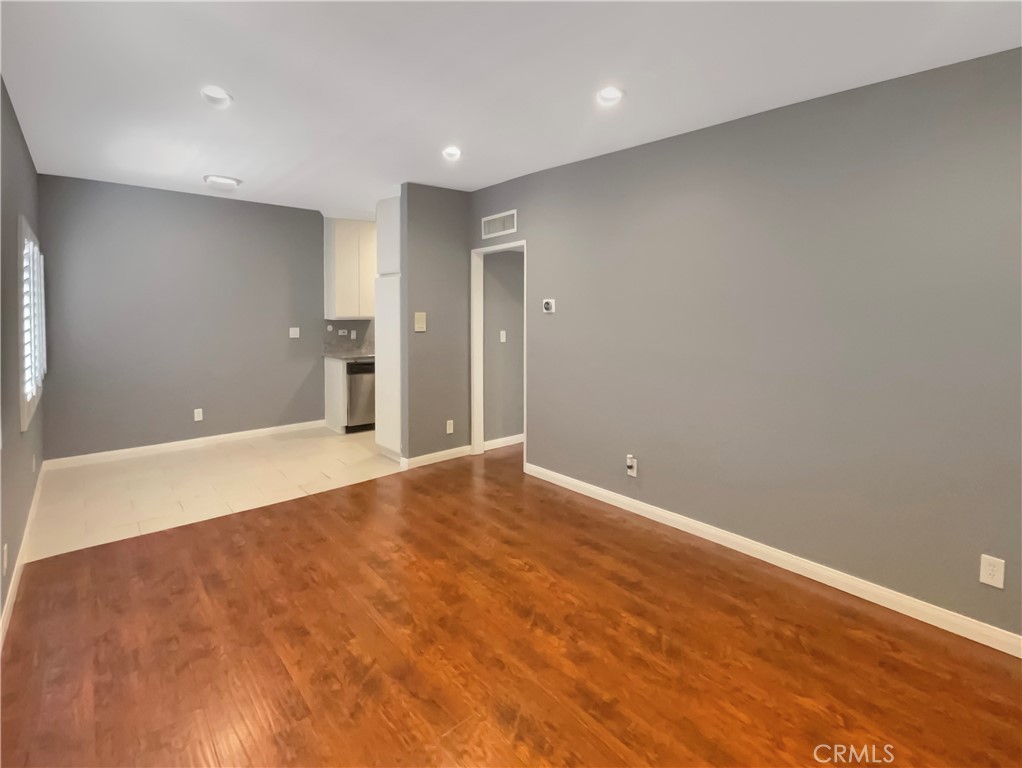 14560 Clark Street, Unit 202 Sherman Oaks, CA 91411 - Photo 3 of 18 a view of an empty room with wooden floor