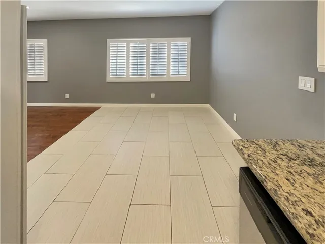 a view of an empty room with windows