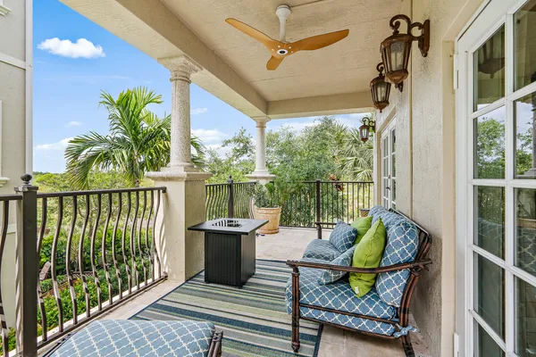 a view of balcony with furniture