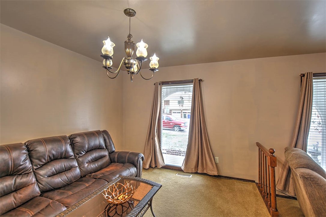 4425 Butler Drive Decatur, IL 62526 - Photo 6 of 22 a living room with furniture flowerpot and a window