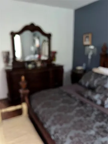 a kitchen with granite countertop stainless steel appliances and wooden cabinets