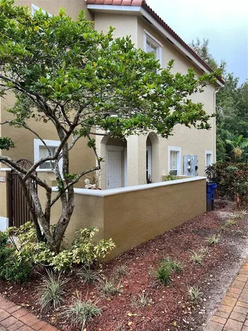 a view of a house with large tree