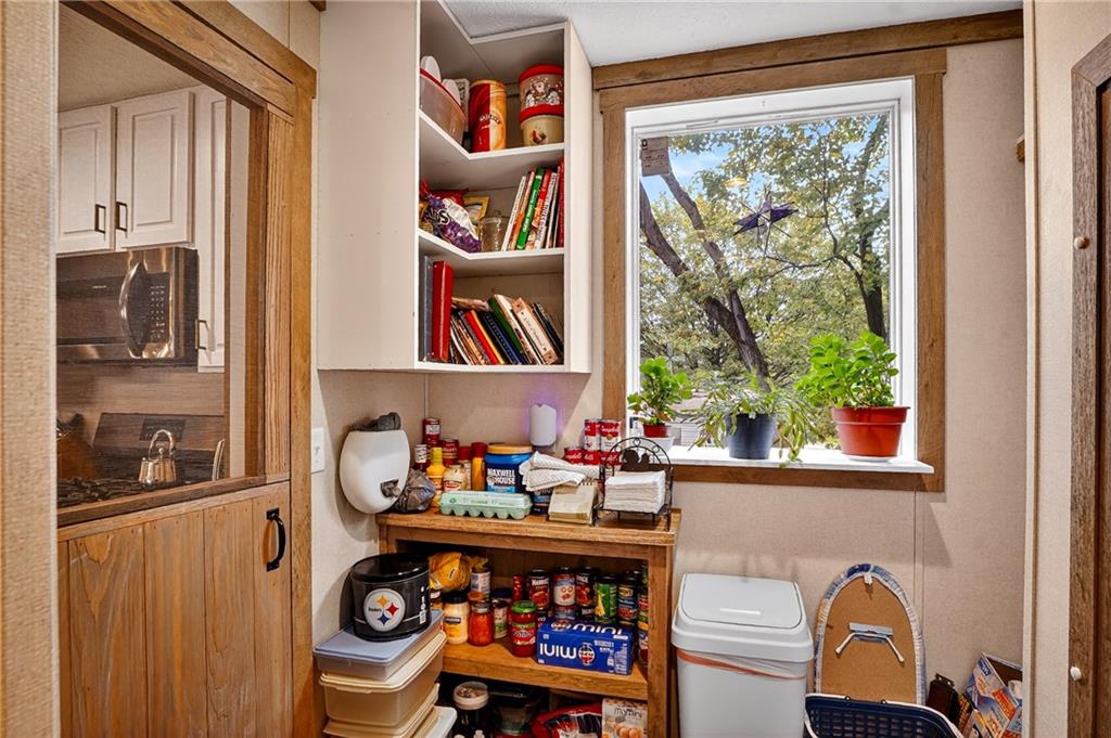426 Perry Circle Cranberry Township, PA 16066 - Photo 17 of 35 a room with wooden furniture and a window