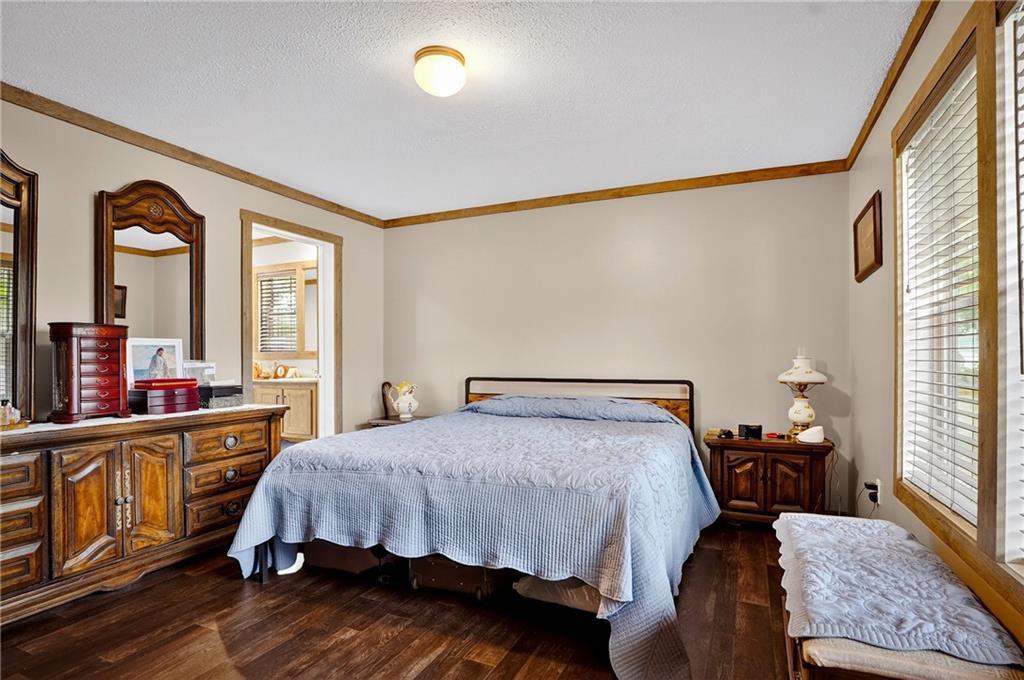 426 Perry Circle Cranberry Township, PA 16066 - Photo 18 of 35 a bedroom with a bed and wooden floor