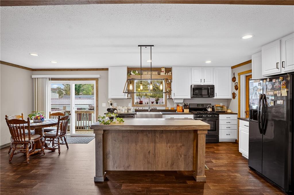 426 Perry Circle Cranberry Township, PA 16066 - Photo 28 of 35 a kitchen with kitchen island a large counter and chairs