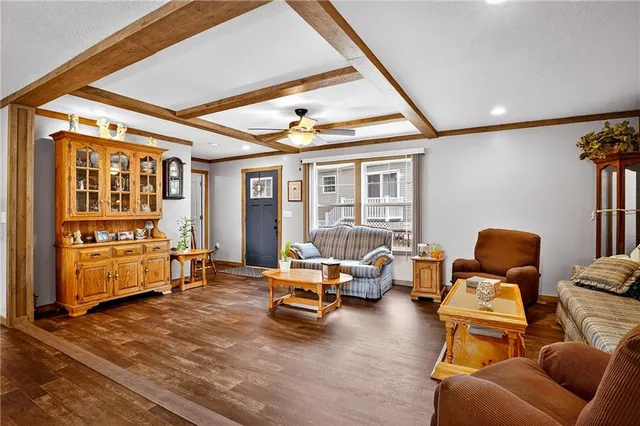a kitchen with refrigerator cabinets and wooden floor