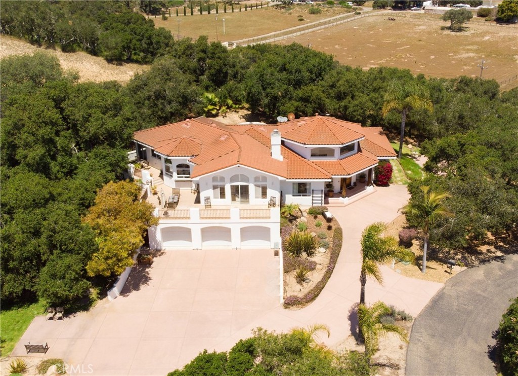 an aerial view of a house with swimming pool and 