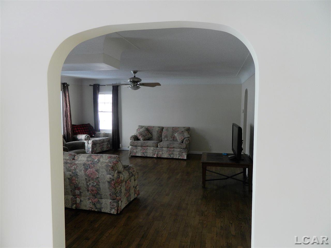 4103 West Beecher Road Adrian, MI 49221 - Photo 7 of 15 Archway entry from dining room to living room adds extra character.