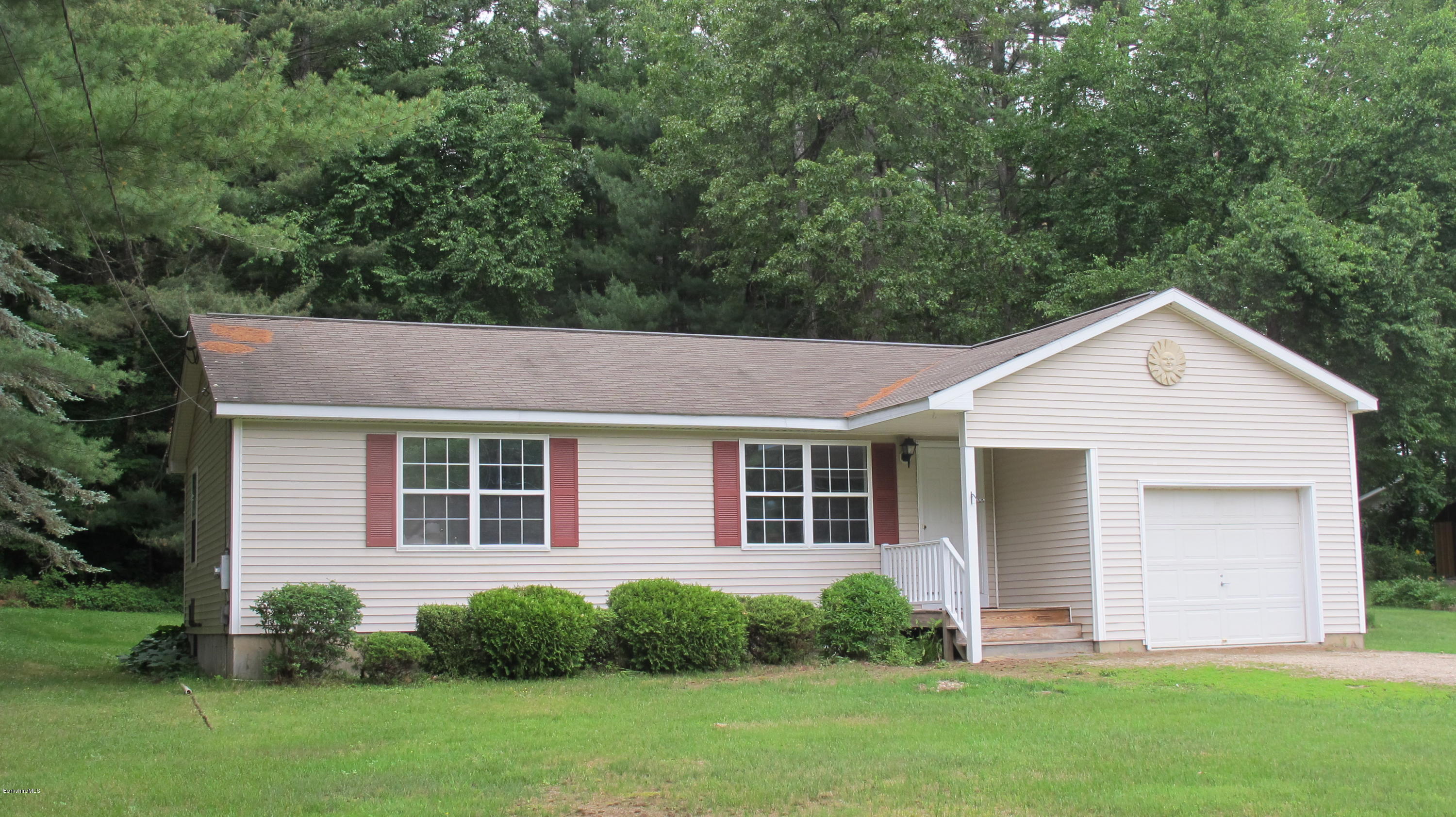 54 Salisbury Road Sheffield, MA 01257 - Photo 1 of 27 a front view of a house with a yard