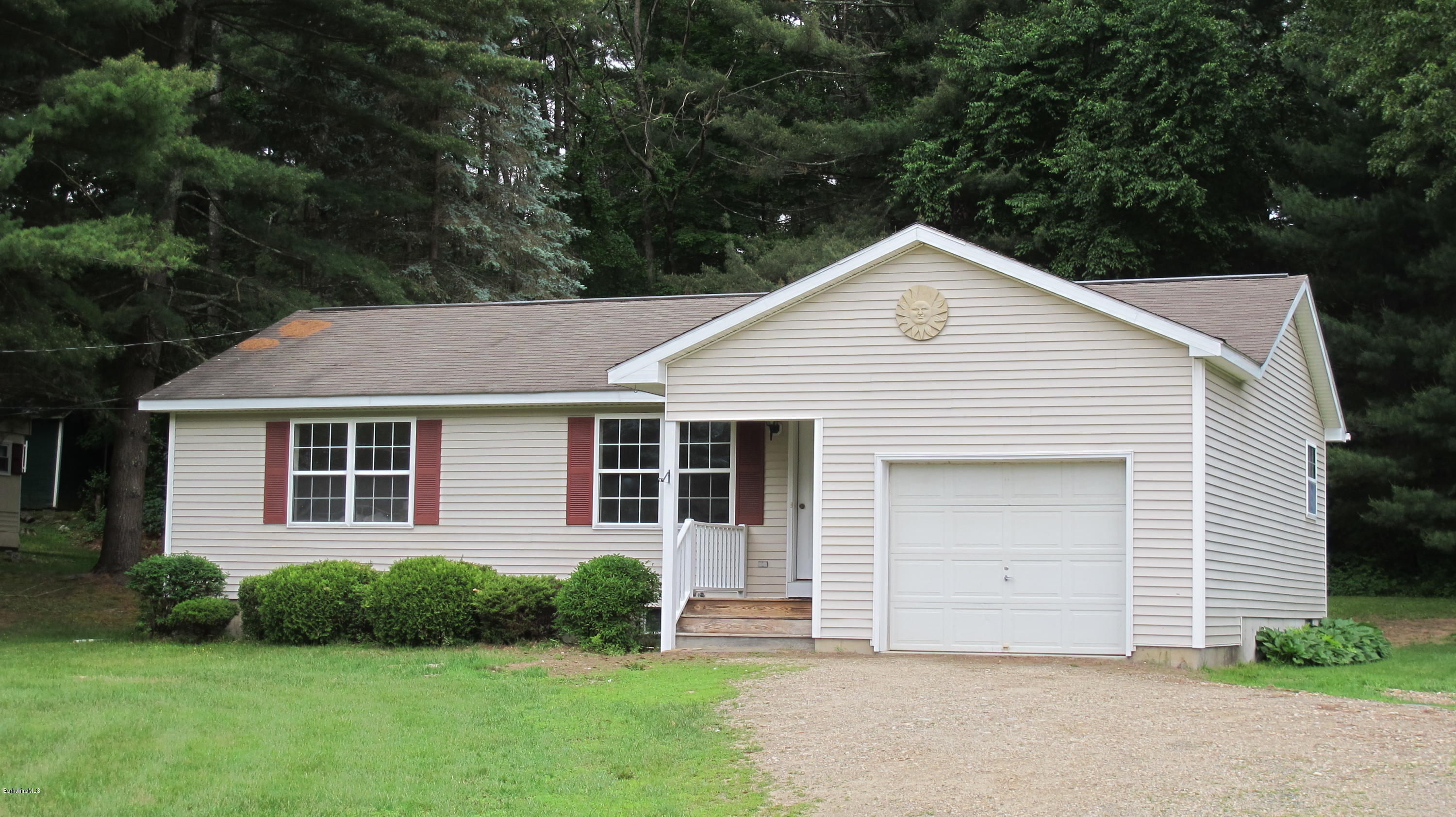 54 Salisbury Road Sheffield, MA 01257 - Photo 2 of 27 a front view of a house with a yard and garage