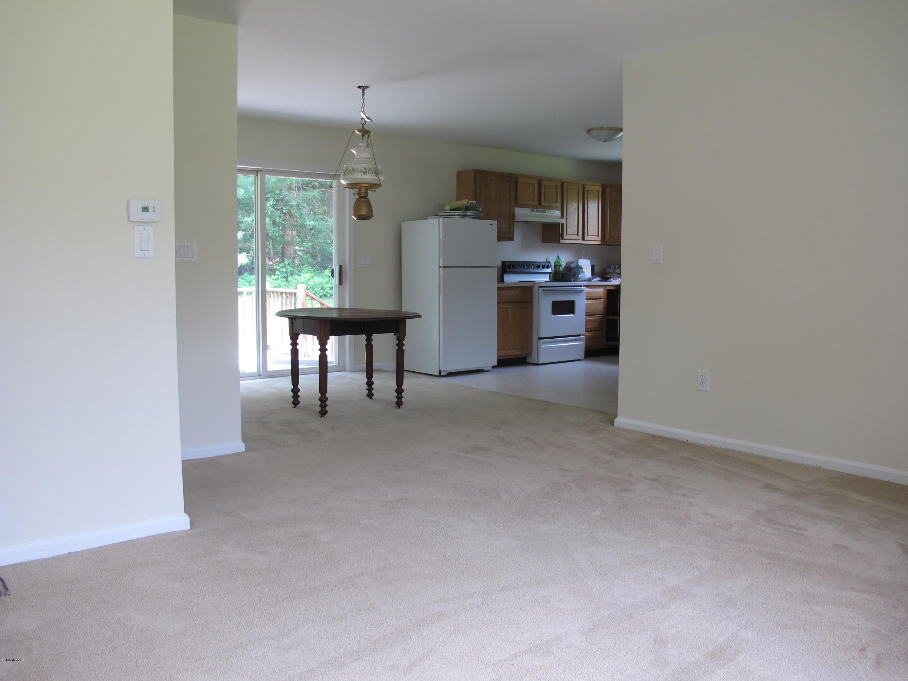 54 Salisbury Road Sheffield, MA 01257 - Photo 4 of 27 a living room with furniture and a kitchen